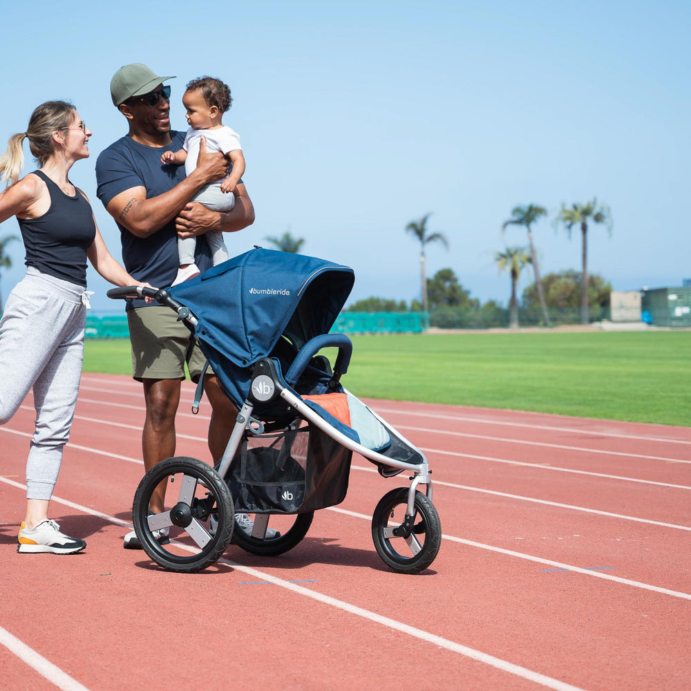 
                  
                    Picture of family getting ready to run on soft running track with Bumbleride Speed jogging stroller in Supernova. New Collection 2022. Global
                  
                